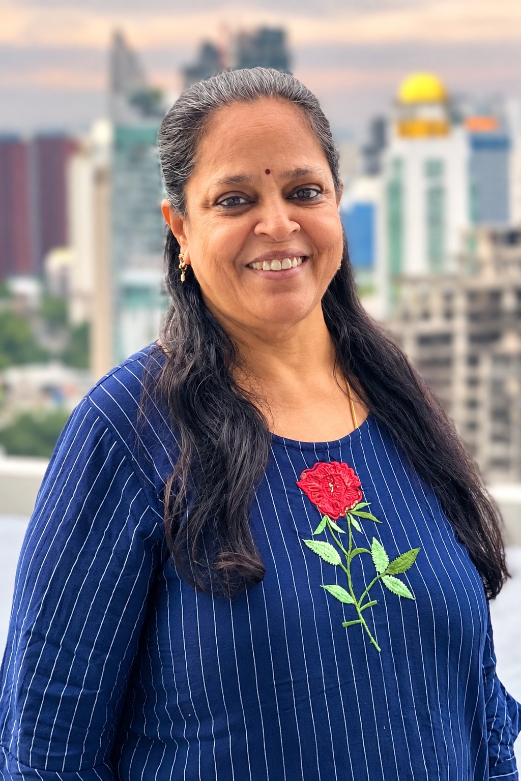 Portrait of Indira Vetrivel outdoors, Founder and Managing Director of M3DHA